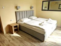 Postel nebo postele na pokoji v ubytování Lazur Apartamenty