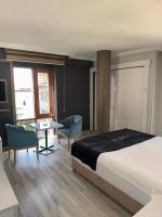 Postel nebo postele na pokoji v ubytování Yilmazel Hotel