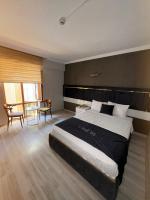 Postel nebo postele na pokoji v ubytování Yilmazel Hotel