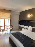 Postel nebo postele na pokoji v ubytování Yilmazel Hotel