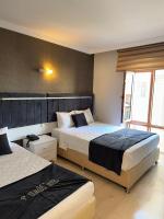 Postel nebo postele na pokoji v ubytování Yilmazel Hotel