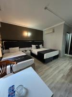 Postel nebo postele na pokoji v ubytování Yilmazel Hotel