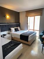 Postel nebo postele na pokoji v ubytování Yilmazel Hotel
