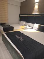 Postel nebo postele na pokoji v ubytování Yilmazel Hotel