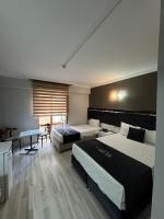 Postel nebo postele na pokoji v ubytování Yilmazel Hotel