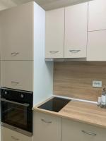 Kuchyň nebo kuchyňský kout v ubytování Апартамент Easy Lux