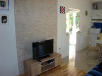 TV a/nebo společenská místnost v ubytování Apartments Pinus