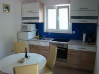 Kuchyň nebo kuchyňský kout v ubytování Apartments Pinus