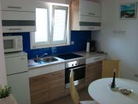 Kuchyň nebo kuchyňský kout v ubytování Apartments Pinus