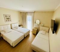Posteľ alebo postele v izbe v ubytovaní Hotel London