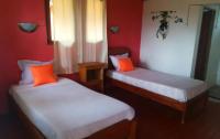 Ένα ή περισσότερα κρεβάτια σε δωμάτιο στο GO Andasibe Hotel