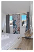 Posteľ alebo postele v izbe v ubytovaní Ostia Holiday Mykonos