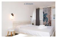 Posteľ alebo postele v izbe v ubytovaní Ostia Holiday Mykonos
