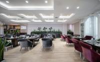 Un restaurante u otro lugar para comer en Suning Universal Hotel ALL-SUITES