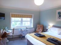 Postel nebo postele na pokoji v ubytování Wildwood B&B