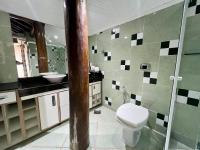 a bathroom with a toilet and a sink at Espaço Verano - Suíte Master 2 in Niterói