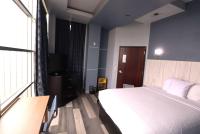 Ein Bett oder Betten in einem Zimmer der Unterkunft Days Inn &amp; Suites by Wyndham Milwaukee