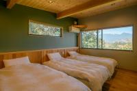 女性のための森サウナ 一棟貸し宿 SORA 宙 Forest sauna villa SORAにあるベッド