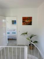 A bed or beds in a room at Bonaire Beach House