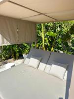 A bed or beds in a room at Bonaire Beach House