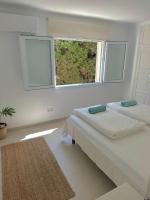 A bed or beds in a room at Bonaire Beach House