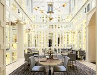 a restaurant with tables and chairs in a building at Only YOU Boutique Hotel Madrid in Madrid