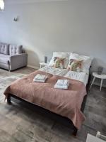 Posteľ alebo postele v izbe v ubytovaní Górski Apartament