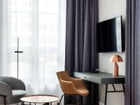 Televízia a/alebo spoločenská miestnosť v ubytovaní Mercure Krakow Fabryczna City