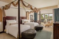 Sharq Village & Spa, a Ritz-Carlton Hotelにあるベッド
