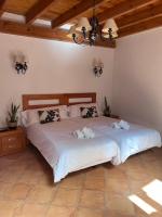 Posteľ alebo postele v izbe v ubytovaní Sitjar Casa Rural