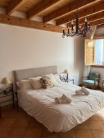 Posteľ alebo postele v izbe v ubytovaní Sitjar Casa Rural