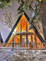 a cabin in the woods in the snow at ZLATARSKA IDILA in Nova Varoš