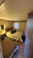 Casa para temporadaにあるベッド