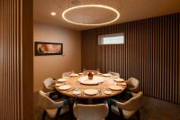 a dining room with a large table and chairs at DoubleTree by Hilton Hobart in Hobart