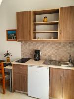Kuchyň nebo kuchyňský kout v ubytování Nina Apartments