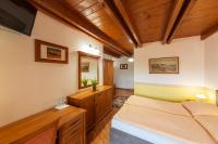 Łóżko lub łóżka w pokoju w obiekcie Hotel El Greco