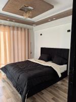 Postel nebo postele na pokoji v ubytování Apartment in jannet zayed 2
