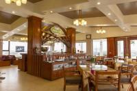 a restaurant with tables and chairs and a bar at Phuong Anh Hotel 2 Hai Duong in Hải Dương