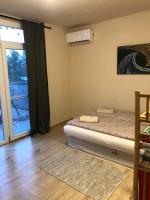 Posteľ alebo postele v izbe v ubytovaní Crystal Spas Apartman-Balaton
