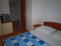Postel nebo postele na pokoji v ubytování Apartments Mia