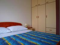 Postel nebo postele na pokoji v ubytování Apartments Mia