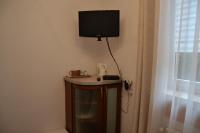 Telewizja i/lub zestaw kina domowego w obiekcie Apartament i pokoje Szalawa
