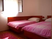 Postel nebo postele na pokoji v ubytování Apartments Mia