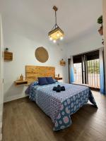 Posteľ alebo postele v izbe v ubytovaní Apartamento El Olivo Vejer