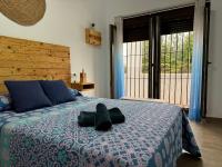 Posteľ alebo postele v izbe v ubytovaní Apartamento El Olivo Vejer