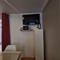 Televízia a/alebo spoločenská miestnosť v ubytovaní Mobil home 6 à 8 personnes SANS Fun Pass