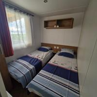 Posteľ alebo postele v izbe v ubytovaní Mobil home 6 à 8 personnes SANS Fun Pass