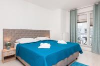Łóżko lub łóżka w pokoju w obiekcie Apartamenty Aquamarina by Noclegi Renters