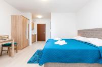 Łóżko lub łóżka w pokoju w obiekcie Apartamenty Aquamarina by Noclegi Renters