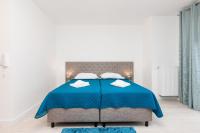 Łóżko lub łóżka w pokoju w obiekcie Apartamenty Aquamarina by Noclegi Renters